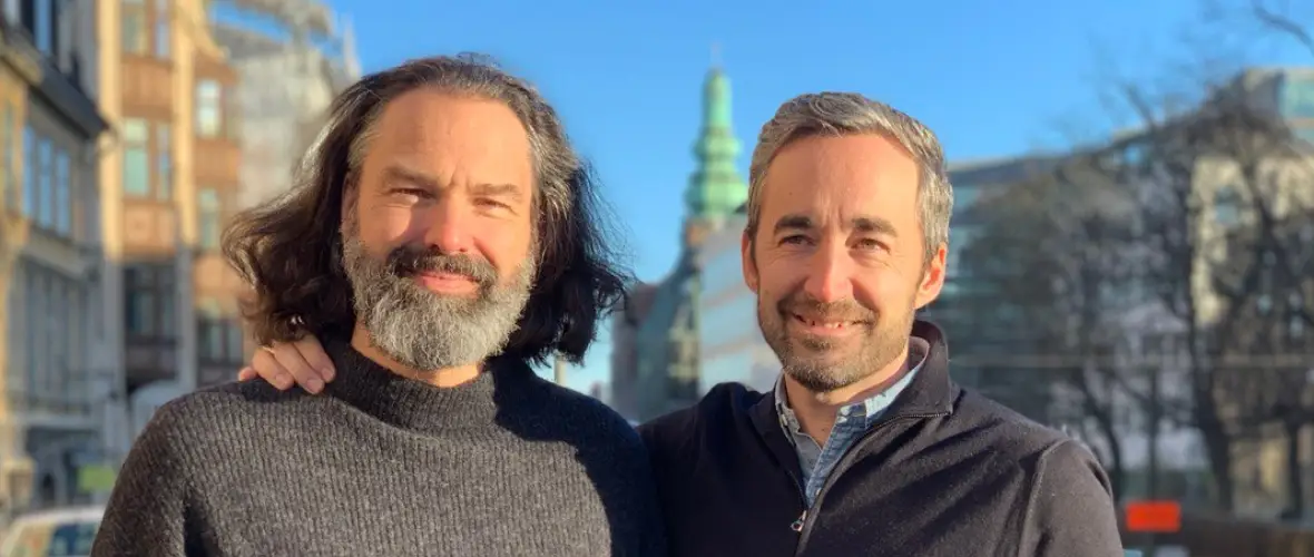 Johan Crona and Daniel Ewerman standing next to each other in the center of Stockholm.