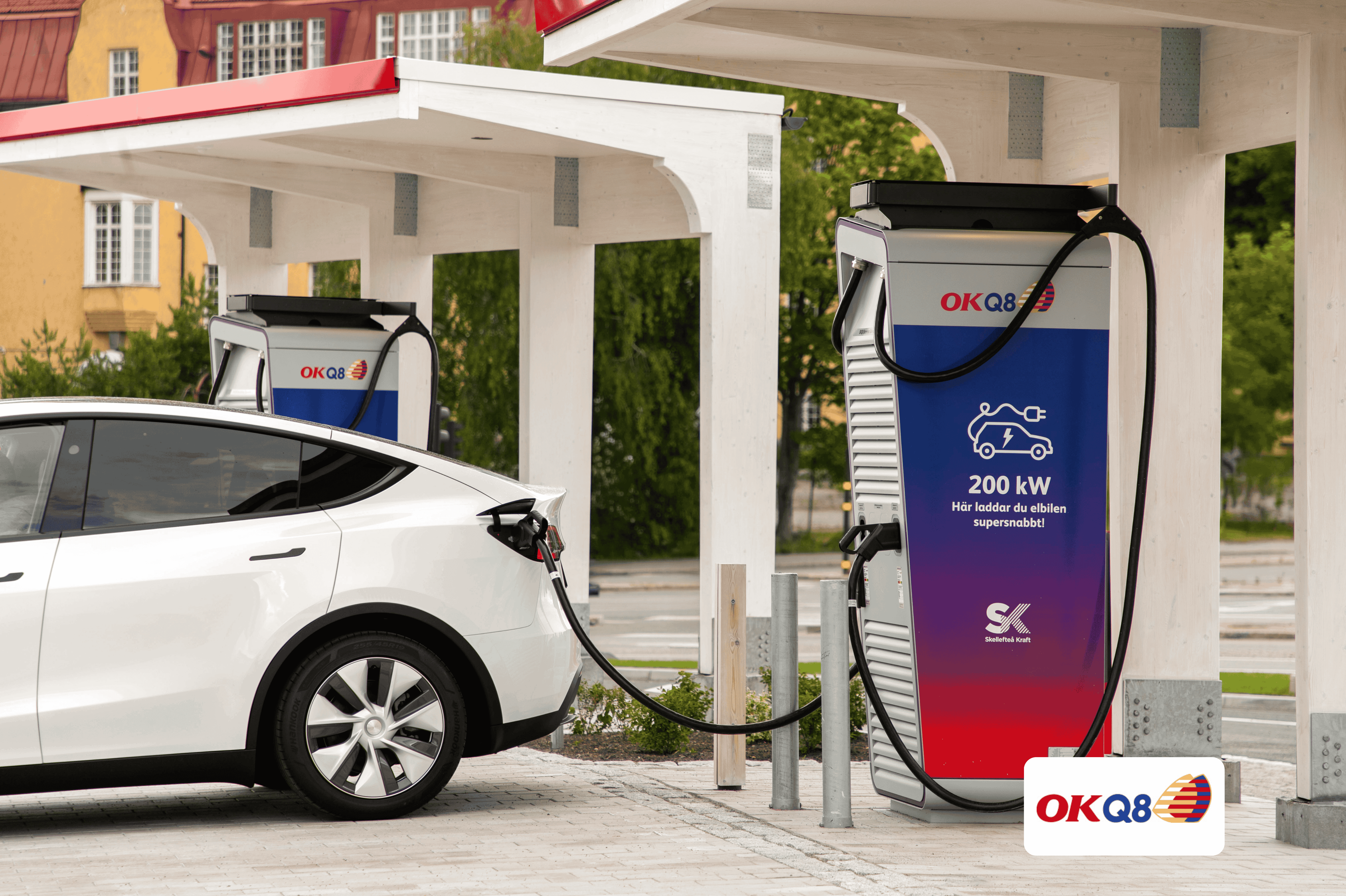 A car getting fuel on a OKQ8 gas station.