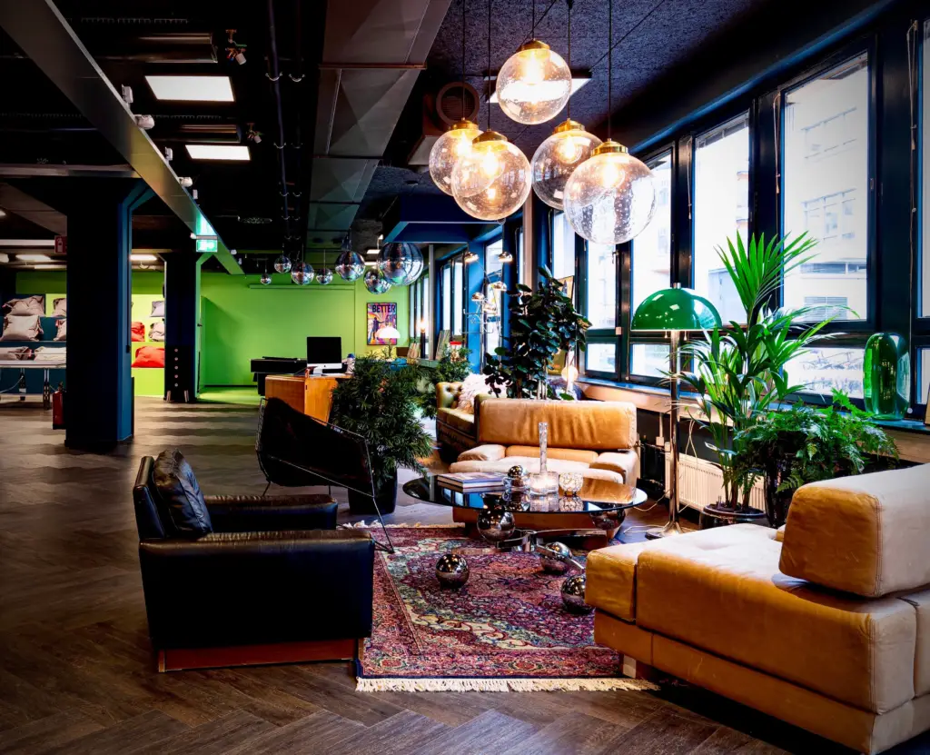 Lounge area at the entrance at CDON. The area have both lounge furniture, pool table, piano and more. Enhances both employee and customer experience.